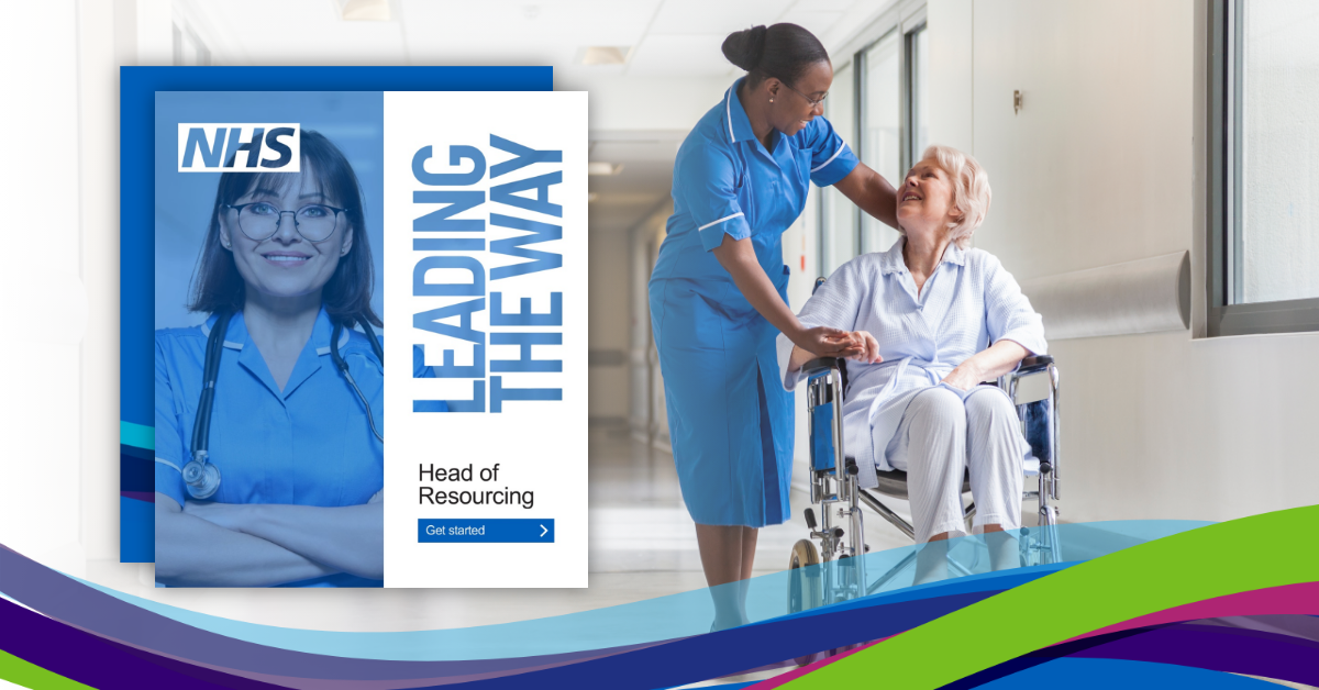 NHS hospital staff talking in a ward corridor 